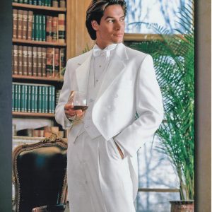 Man wearing white tuxedo in library